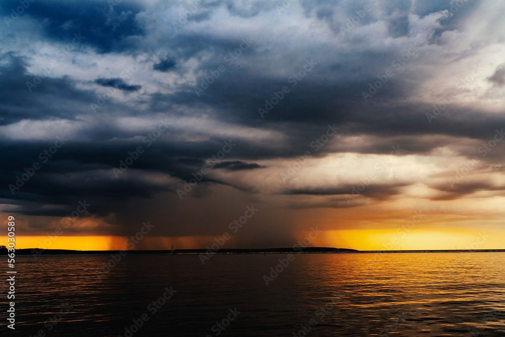 storm is approaching from the sea, photo at sunset