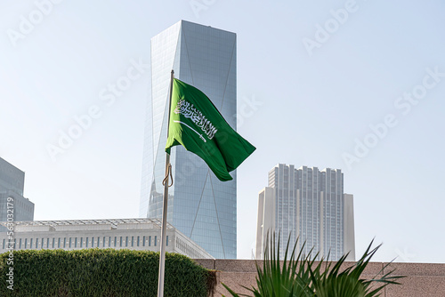 flag of Saudi Arabia against the background of tall building,
