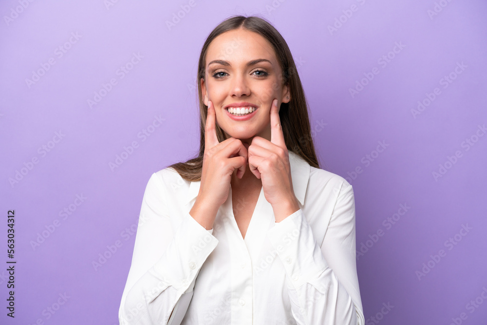 Young caucasian woman isolated on purple background smiling with a happy and pleasant expression Young caucasian woman isolated on purple background smiling with a happy and pleasant expression
