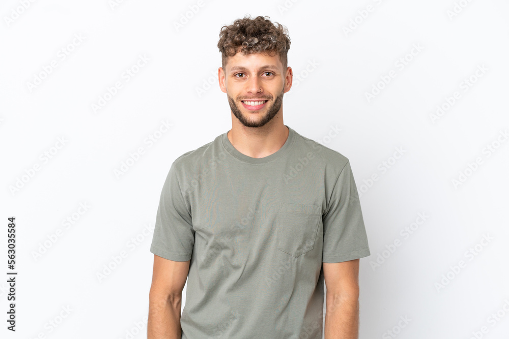 Fototapeta premium Young caucasian handsome man isolated on white background laughing