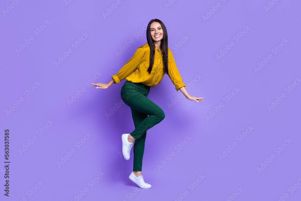Full body portrait of carefree satisfied lady enjoy dancing partying good mood isolated on purple color background