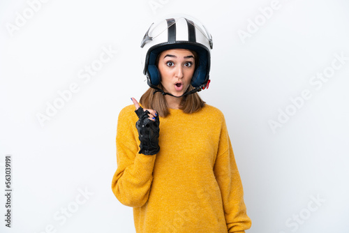 Young caucasian woman with a motorcycle helmet isolated on white background intending to realizes the solution while lifting a finger up