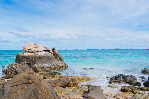 Wallpaper Mural Group of rocks on the beach with emerald sea and clear blue bright sky with copy space at Kham Island (Koh Kham), Chonburi, Thailand Torontodigital.ca