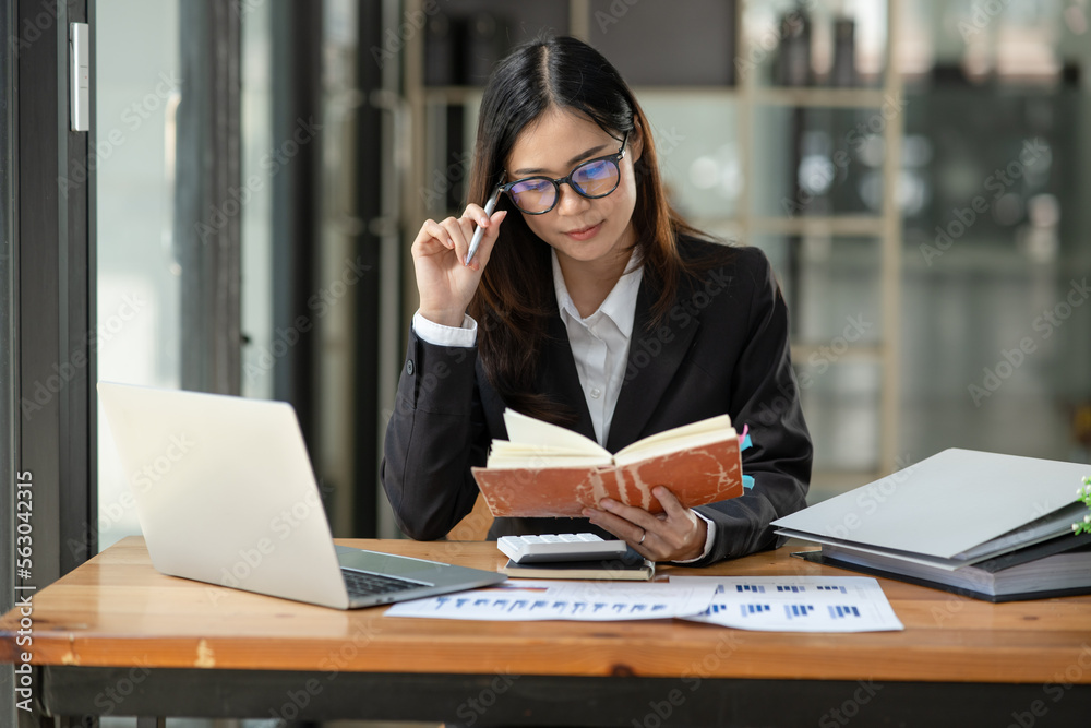 Fototapeta premium Female lawyer working at client's office discussing documents