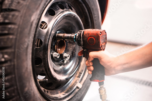 Car maintenance and auto service garage concept. Mechanic repairs detail.