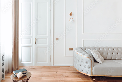 Interior design details - stylish modern furniture and wooden floors in residential home