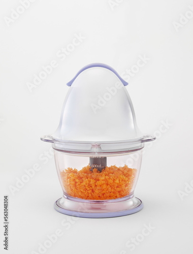 Blender, food processor and minced carrot inside