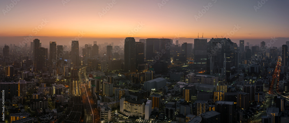 Obraz premium Panoramic aerial view of dense city high rise buildings before dawn