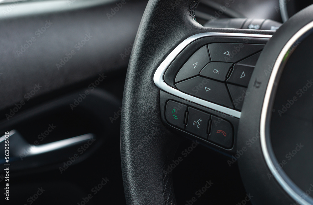 Buttons on the steering wheel, hands-free system, steering wheel controls. The concept of using technology in the car.