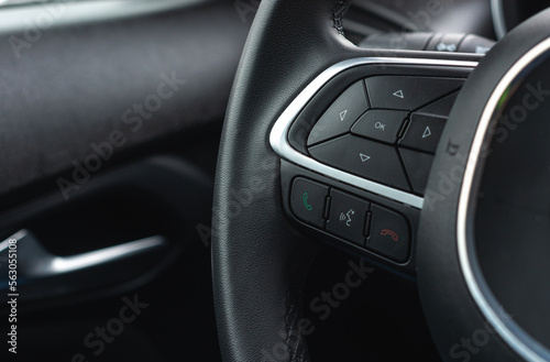 Buttons on the steering wheel, hands-free system, steering wheel controls. The concept of using technology in the car.