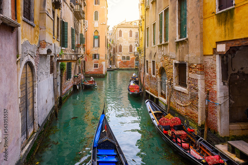 Narrow canal with gondola in Venice, Italy. Architecture and landmark of Venice. Cozy cityscape of Venice.