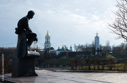 February 19, 2022. Kyiv, Ukraine. Monument to Bykov and Soviet soldiers pilots against the backdrop of the Lavra Bell Tower, the Holodomor Museum and the obelisk of eternal glory