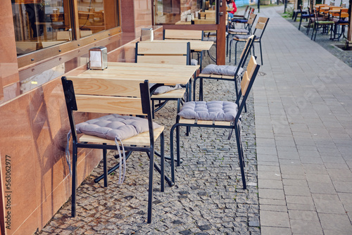 Outdoor street cafe tables ready for service. © Ryzhkov Oleksandr