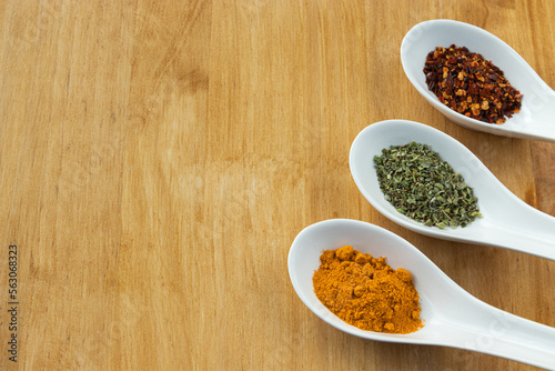 Aromatic spices on wood background. Copy space. Healthy cooking.