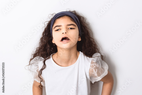 curly dark hair child girl over white background photo