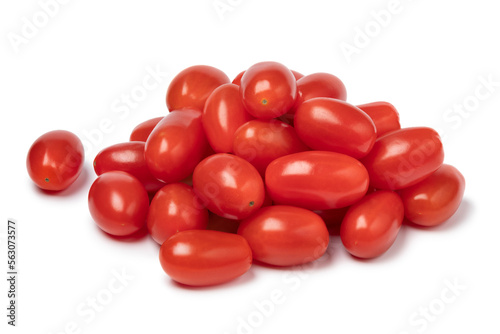 Heap of fresh small red sweet snack tomatoes isolated on white background © Picture Partners