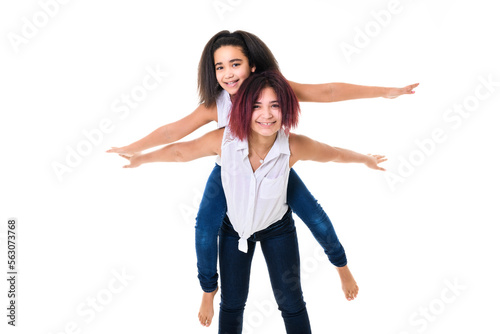 portrait of two beautiful sister over studio background photo