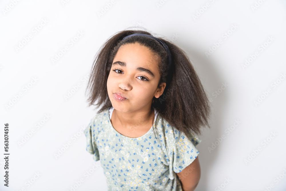 Adorable 9 years child girl on studio white background Adorable 9 years child girl on studio white background