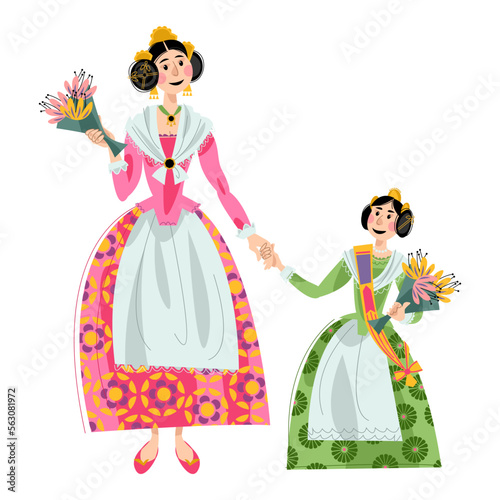 Woman and girl with flowers in traditional clothes during the festival of Las Fallas (Festival of Fire) in Valencia, Spain