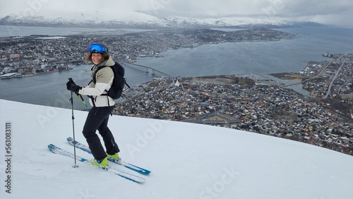 girl backcountry ski in front of Tromsø, Norway