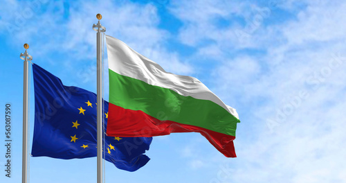 the flags of Bulgaria and the European Union waving in the wind on a sunny day