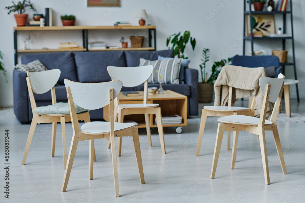 Horizontal image of chairs standing in circle preparing for therapy in the room