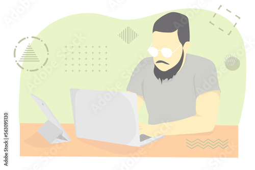 man working with laptop wears glasses and use tablets