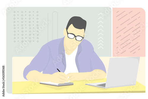 young man working with laptop and writing some notes in the book