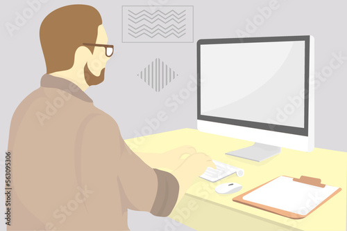 person wroking with computer with some notes