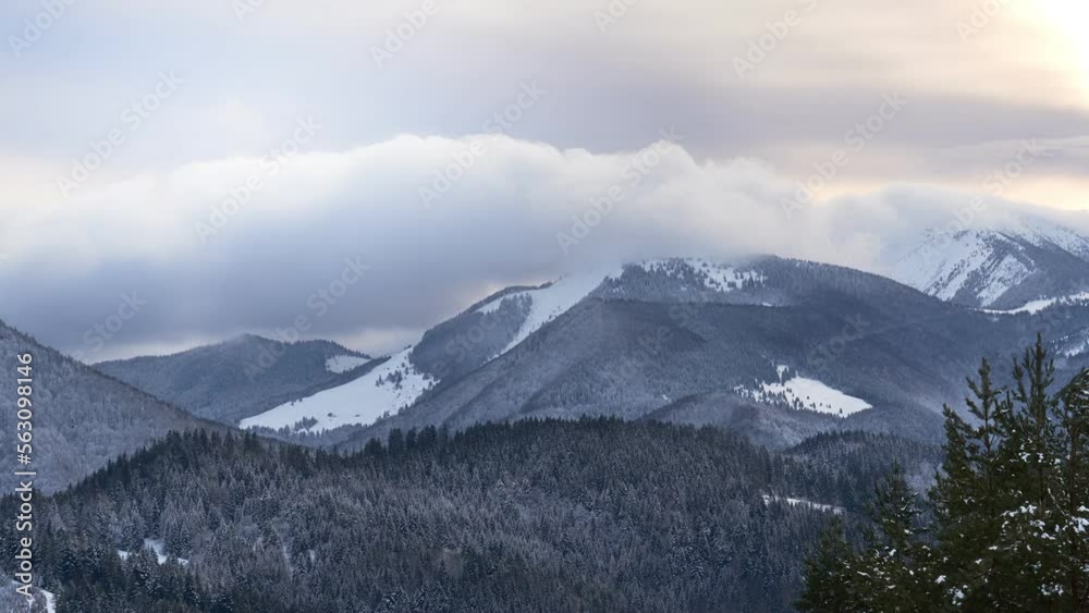 Clouds moving over the mountains during twilight in winter landscape. Tiemlapse Clouds moving over the mountains during twilight in winter landscape. Tiemlapse