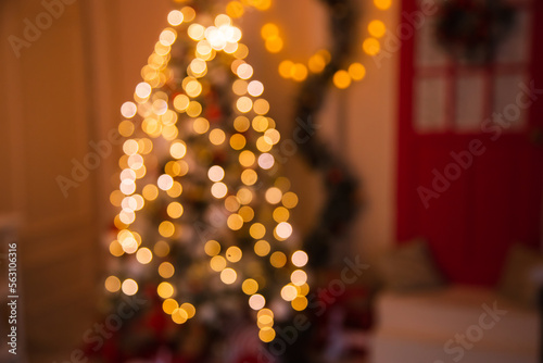 blurred background of lanterns on christmas tree. Christmas bokeh