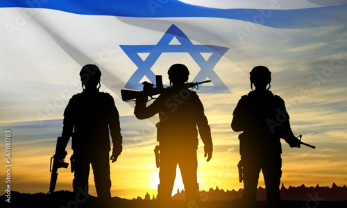 Silhouettes of soldiers with Israel flag against the sunrise. Concept - armed forces of Israel. EPS10 vector