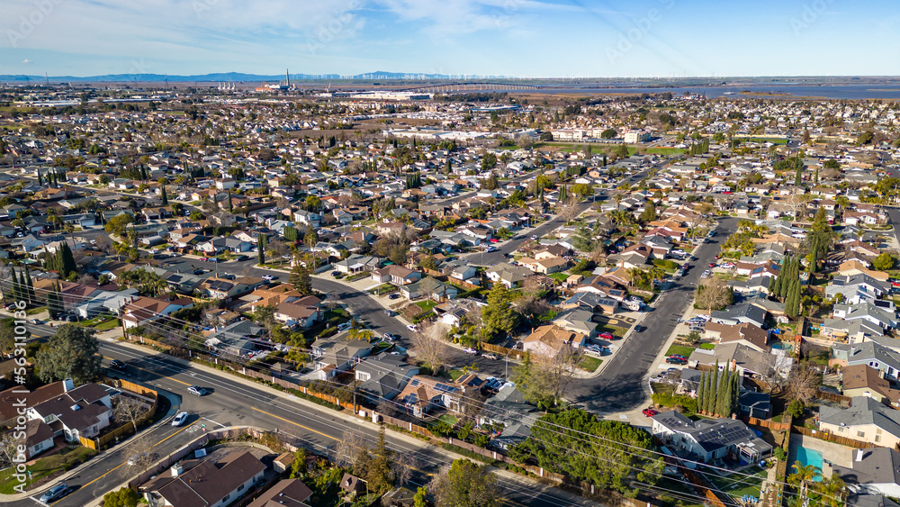 Drone photos of a neighborhood in California with houses, streets, solar and trees