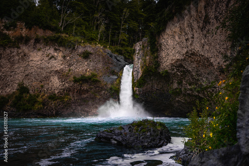 View of waterfall in blue water river. South of Chile