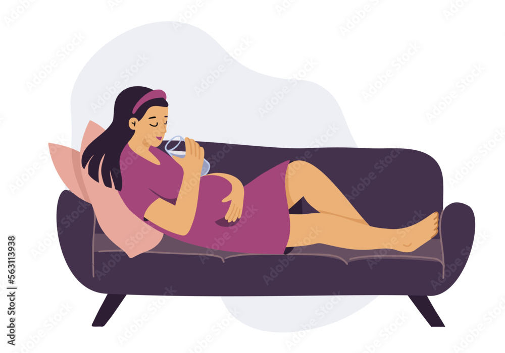 Fototapeta premium Young pregnant woman relaxing on sofa, drinking water. 