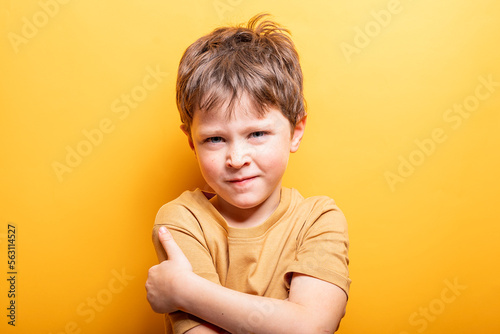 Elementary caucasian boy with angry gesture