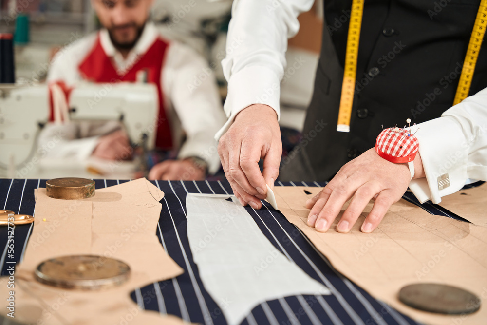 Two professionals working together in clothing atelier
