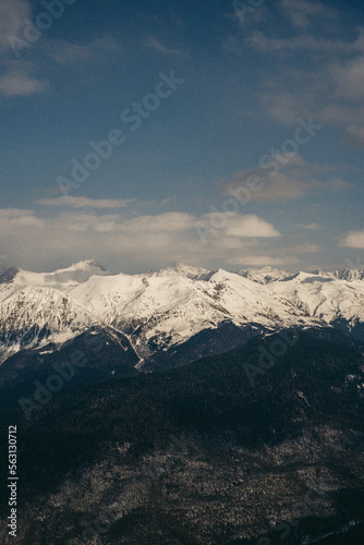 Snowy mountains. Sunny winter day. Amazing snow covered peaks in the Sochi, Russia.