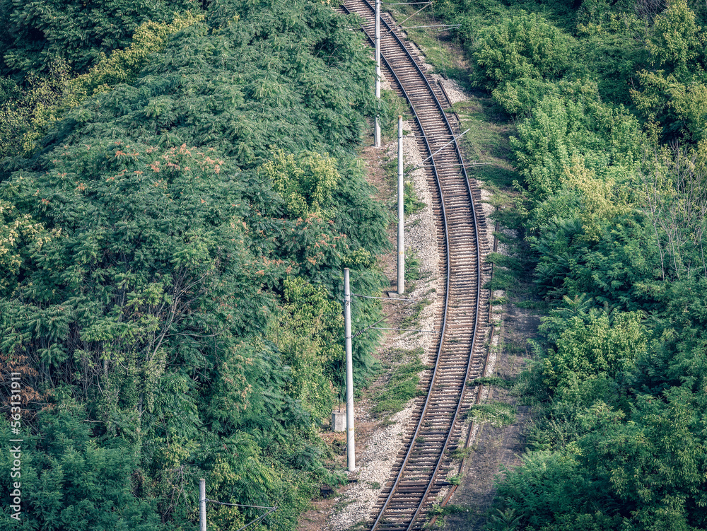 View from above with railroad tracks surrounded by forest near Veliko Tarnovo, Bulgaria View from above with railroad tracks surrounded by forest near Veliko Tarnovo, Bulgaria