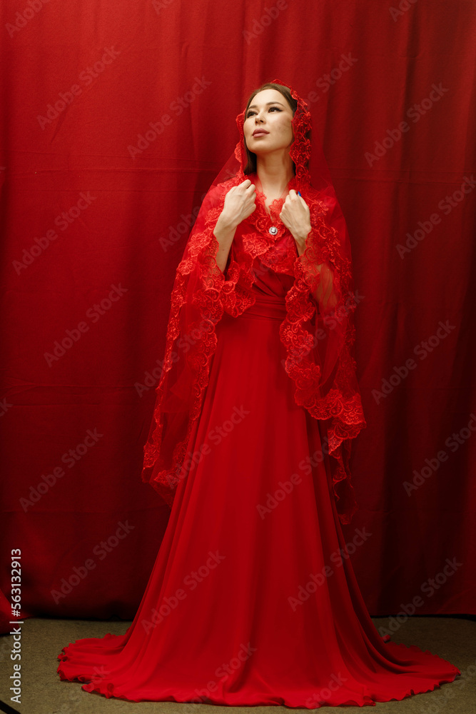 a girl in a red dress on a red background