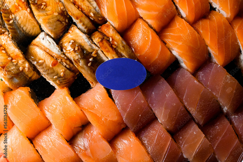 Cropped photo of top view of sushi set of various tasty philadelphia rolls with salmon, tuna, eel