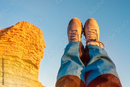 Woman relaxing alone on the seaside at sunset. Travel Lifestyle concept