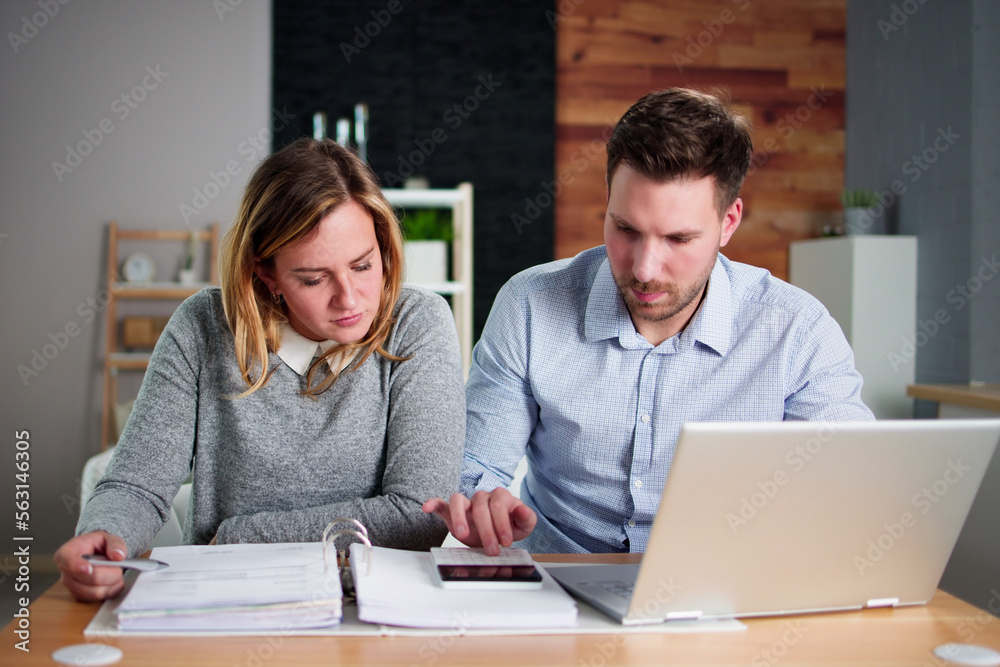 Couple Doing Taxes And Family Budget Couple Doing Taxes And Family Budget