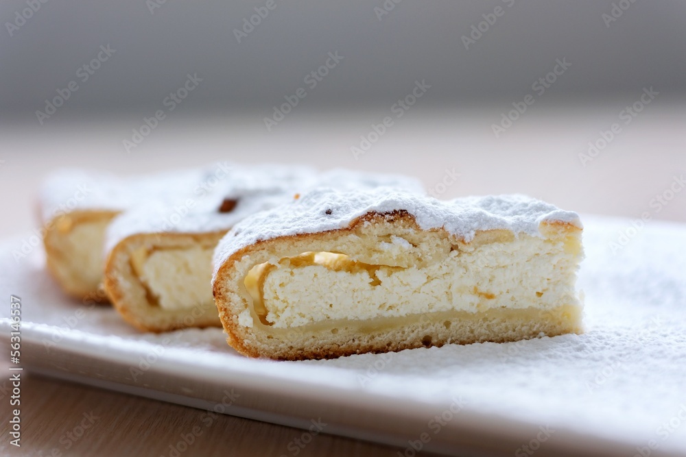cheesecake curd strudel sliced sprinkled with powdered sugar dough is separated from curd creating drawing ad benefits of cooking show recipes restaurant serving delicious on unrealistically beautiful