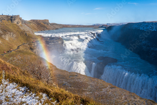 Gullfoss waterfall in Hvítá river canyon in southwest Iceland. Popular falls on the Golden Circle tourism route. Rainbow in the mist from two stage cascade. © EWY Media