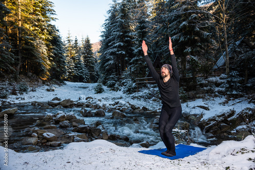 Motivation yoga on the wild nature near the river