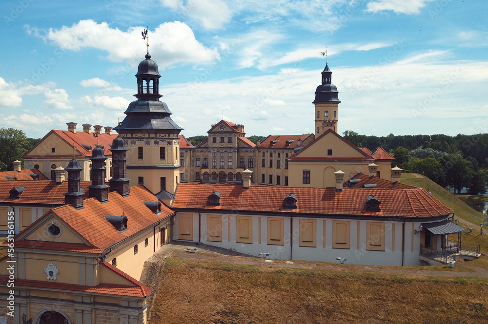 A high earth moat protects a medieval castle in Europe. Defensive architecture of ancient fortresses and castles. An earthen rampart to protect against an attack in an ancient castle. A high earth moat protects a medieval castle in Europe. Defensive architecture of ancient fortresses and castles. An earthen rampart to protect against an attack in an ancient castle.