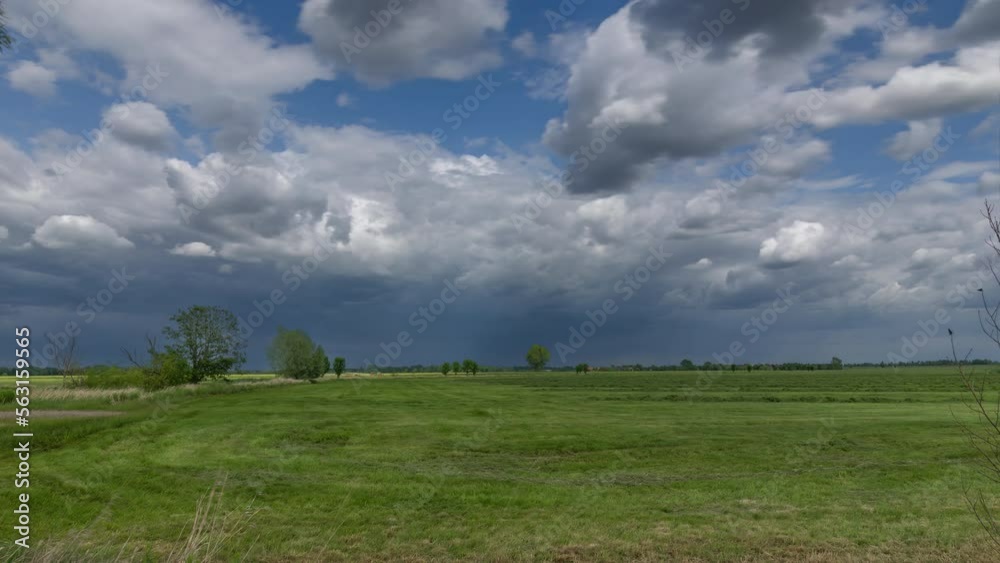 Landscape timelapse of a grain field in Germany taken on a sunny day Agricultural machinery harvesting a field. Landscape timelapse of a grain field in Germany taken on a sunny day Agricultural machinery harvesting a field.