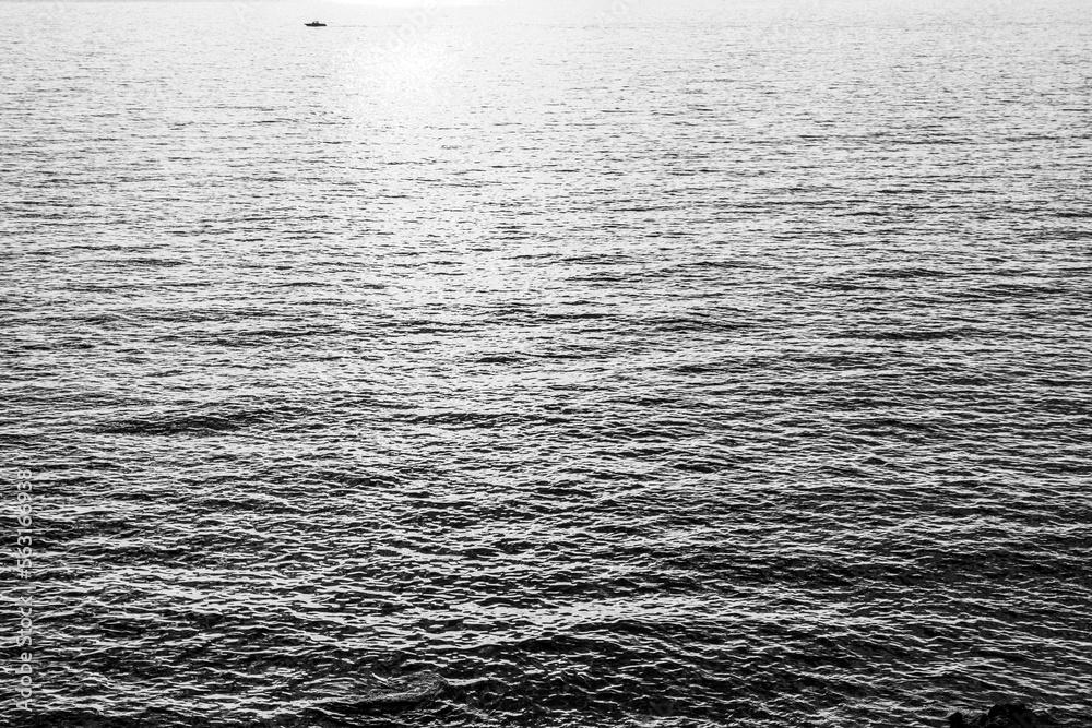 Obraz premium Gray sea background, close-up. A backing with sea waves texture for branding, calendar, postcard, screensaver, wallpaper, poster, banner, cover, website. Toned high quality photo