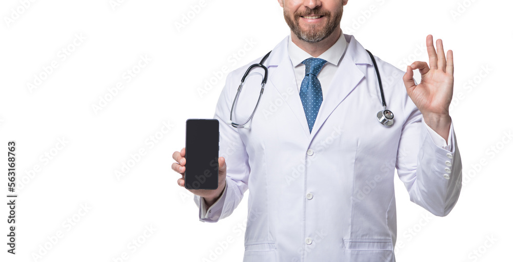 Medical man crop view. Telehealth doctor holding smartphone showing OK. Medical practitioner